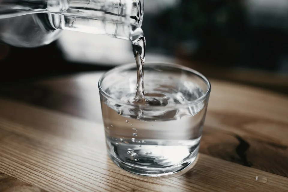 Fresh water being poured into a glass.