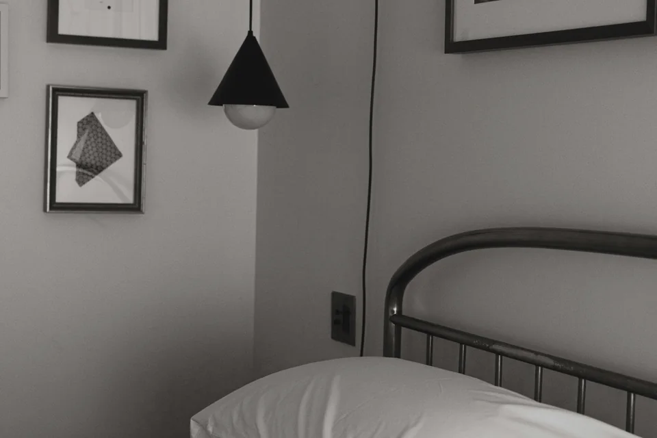 A quiet, uncluttered bedroom prepared for rest.
